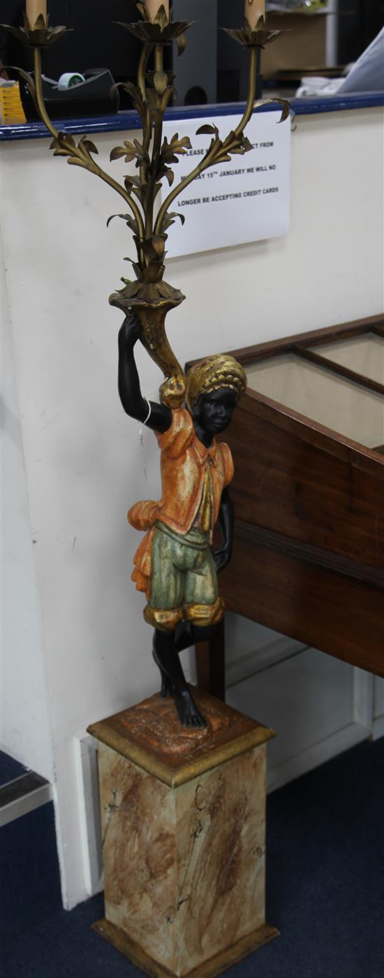 A Blackamoor figure on base W.23cm